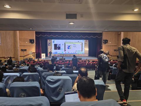 Picture of people going to their seats at PyCon India